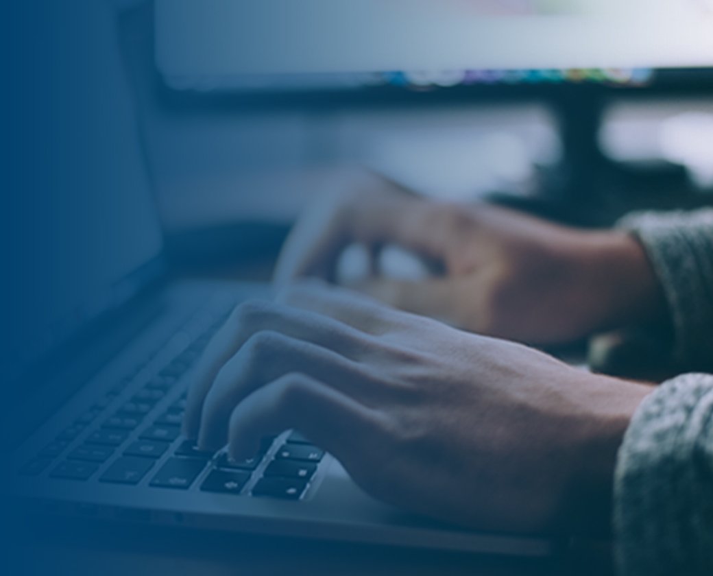 A person's hands typing on a laptop, representing active privacy management.